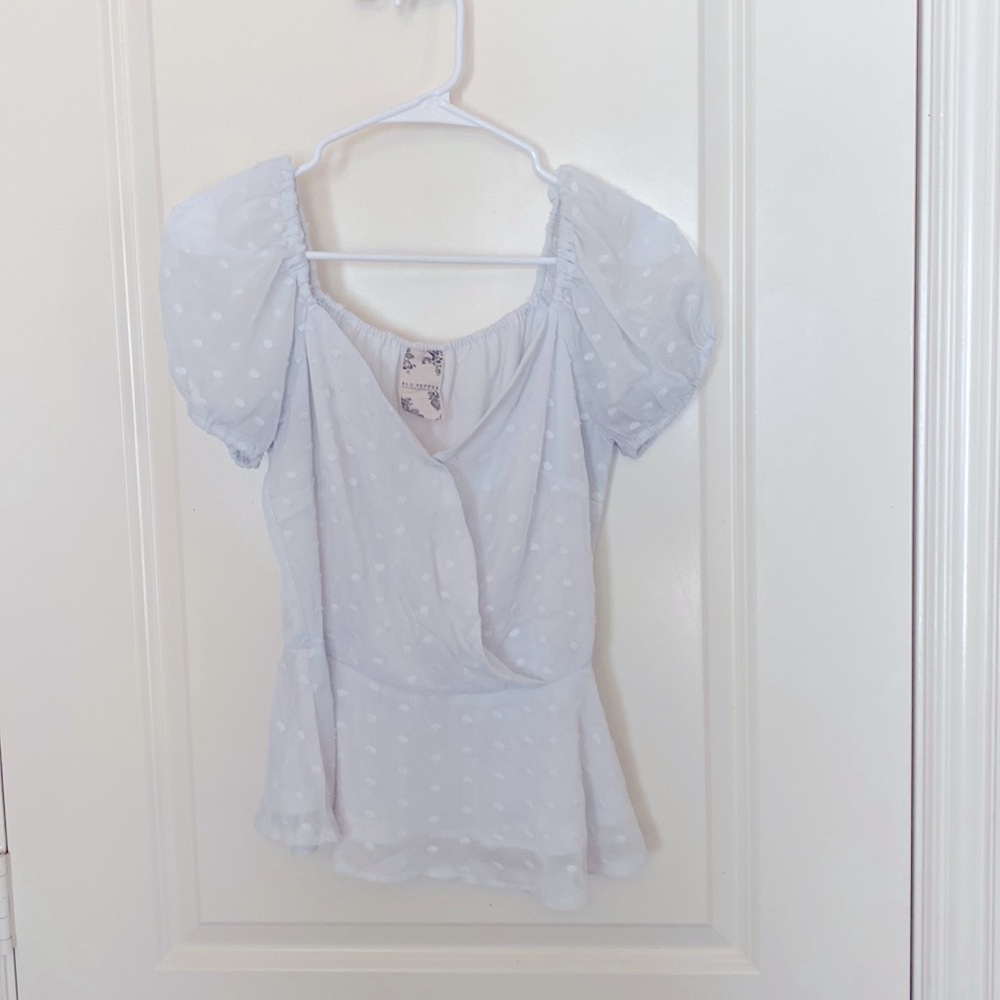 White shirt sleeve peplum top.